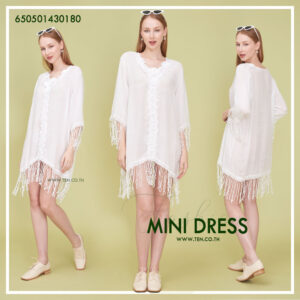 Romantic white dress with floral lace details and fringe hem