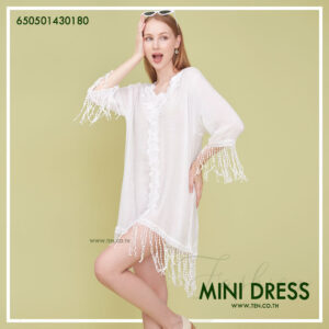 Romantic white dress with floral lace details and fringe hem