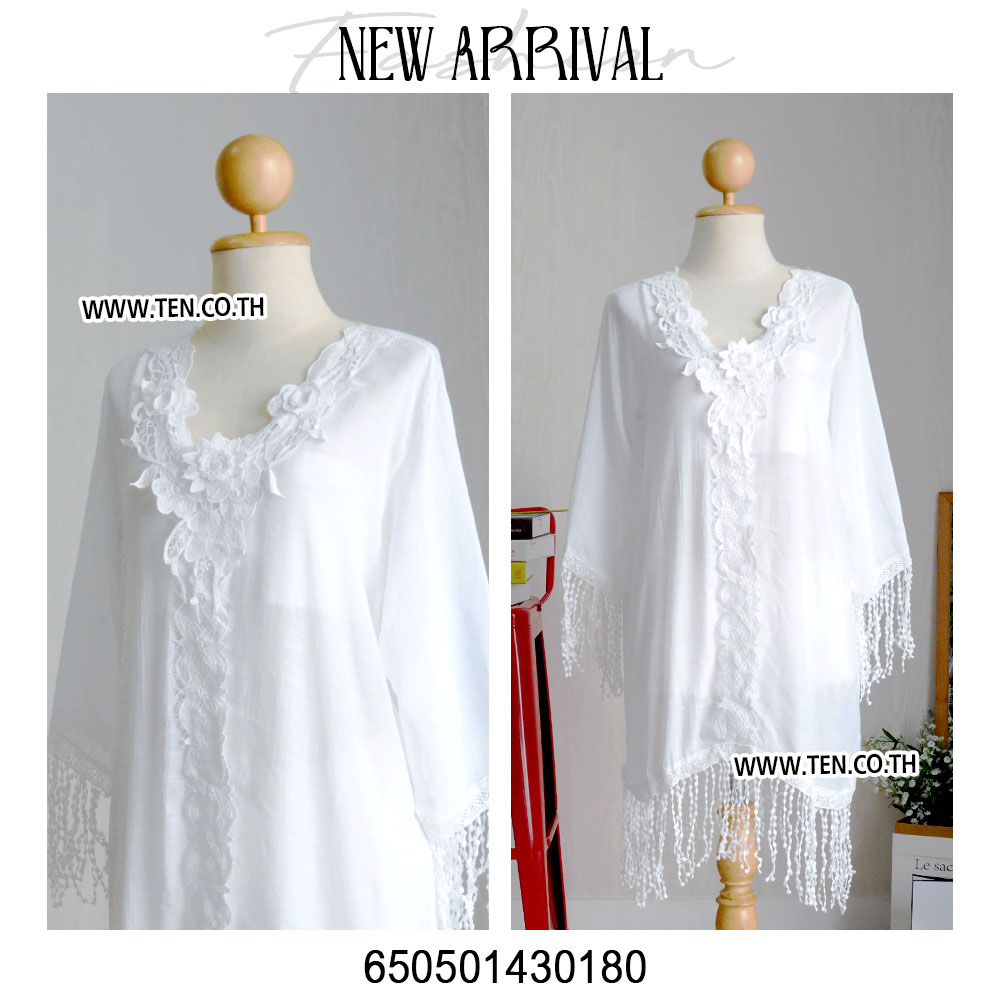 Romantic white dress with floral lace details and fringe hem