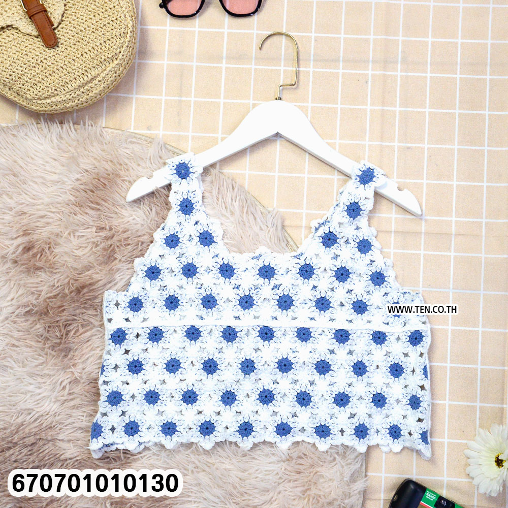 Crochet floral blouse with handmade design, perfect for summer fashion
