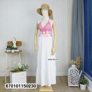 Elegant floral crochet maxi dresses in green and brown on display in a minimalist interior.