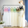 Elegant floral crochet maxi dresses in green and brown on display in a minimalist interior.