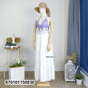 Elegant floral crochet maxi dresses in green and brown on display in a minimalist interior.