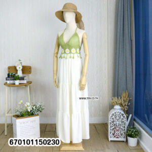 Elegant floral crochet maxi dresses in green and brown on display in a minimalist interior.