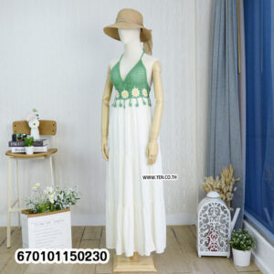 Elegant floral crochet maxi dresses in green and brown on display in a minimalist interior.