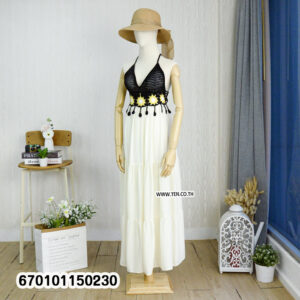 Elegant floral crochet maxi dresses in green and brown on display in a minimalist interior.