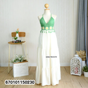 Elegant floral crochet maxi dresses in green and brown on display in a minimalist interior.