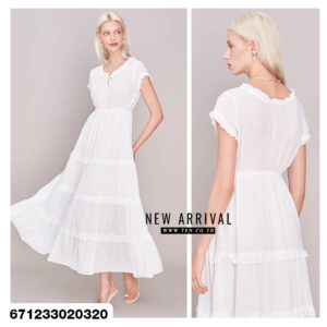 Lightweight summer maxi dresses in white and cream, displayed in a cozy studio setting.