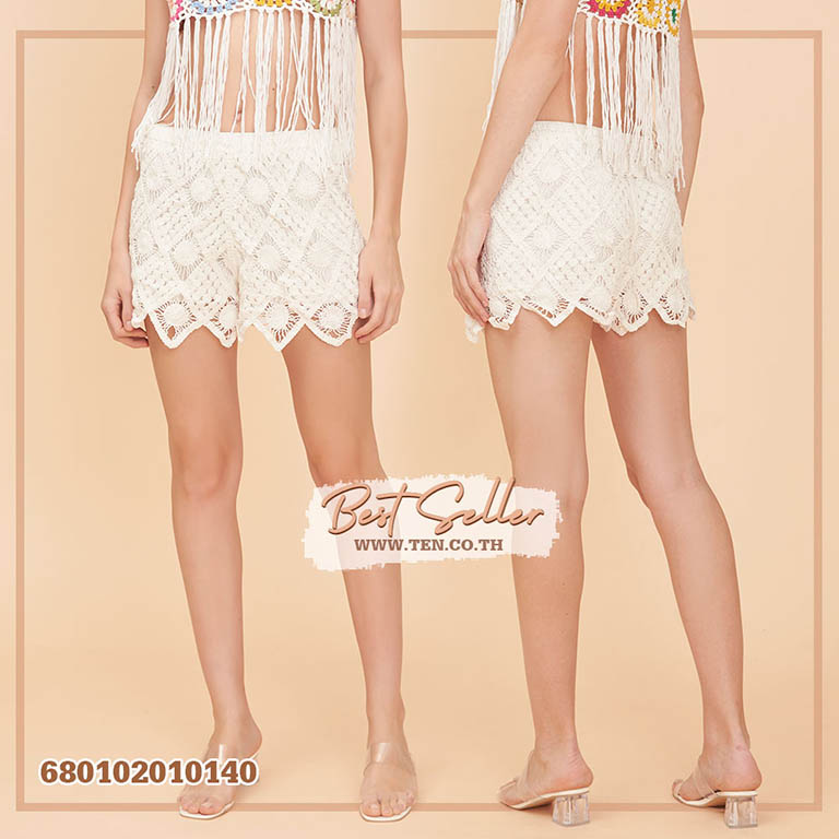 "Boho-chic crochet shorts in black, beige, and white, displayed on hangers and mannequins."