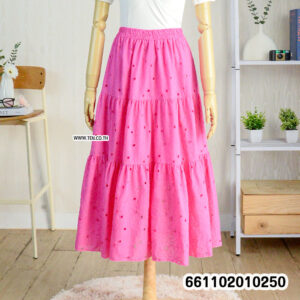Romantic pastel lace skirts hanging on rack with boho details