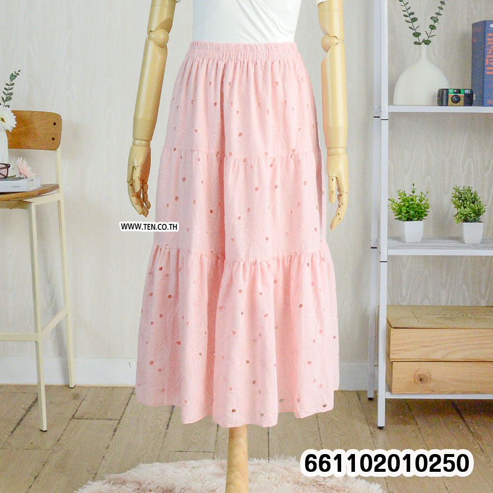 Romantic pastel lace skirts hanging on rack with boho details