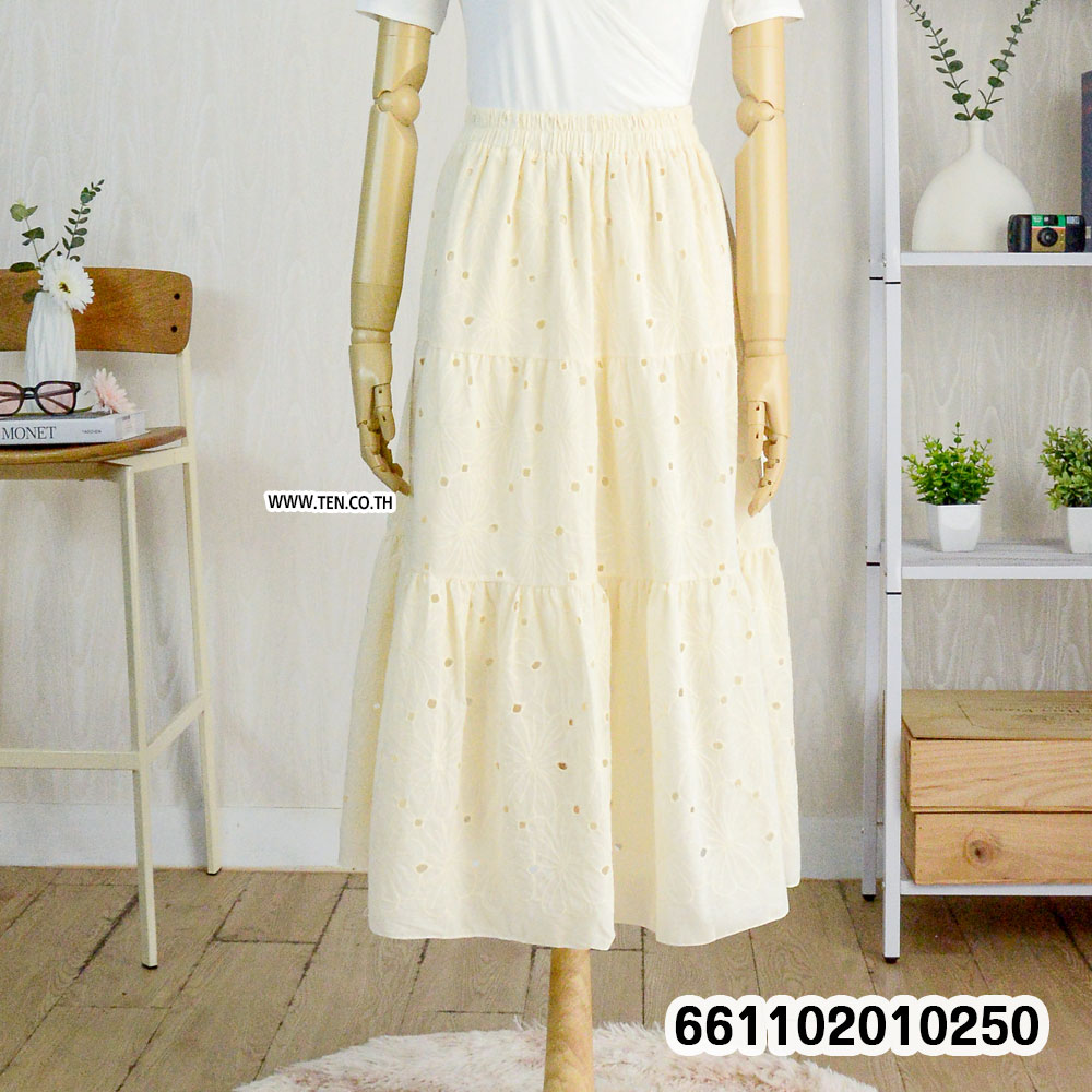 Romantic pastel lace skirts hanging on rack with boho details