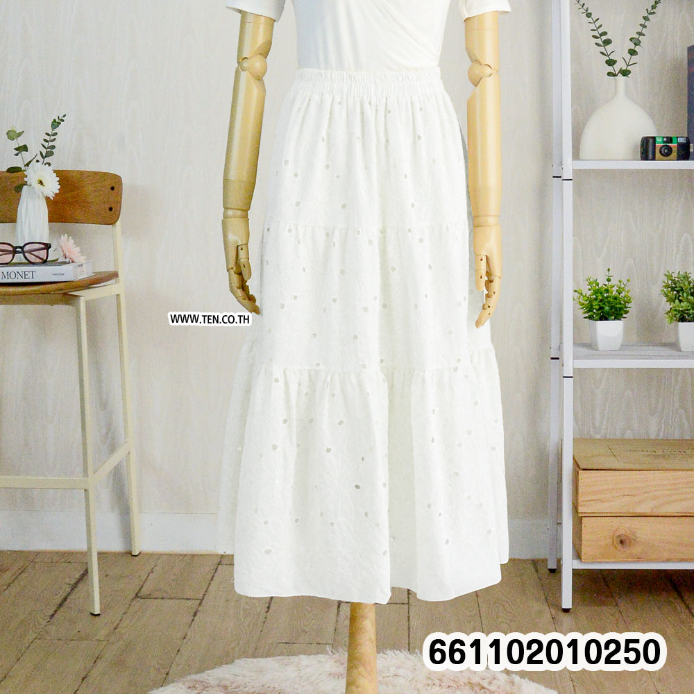 Romantic pastel lace skirts hanging on rack with boho details