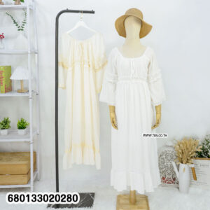 Long sleeve white maxi dress with ruffles and lace on a mannequin