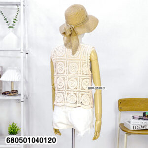 Handmade crochet vest top in off-white displayed on a mannequin with shorts and hat