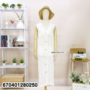 Long sleeveless crochet cardigan with button-down detail displayed on hanger and mannequin