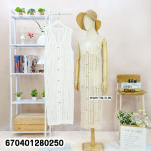 Long sleeveless crochet cardigan with button-down detail displayed on hanger and mannequin