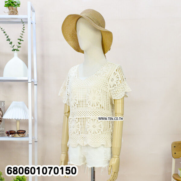 Front and back views of a handmade crochet summer blouse styled with straw hat and white shorts