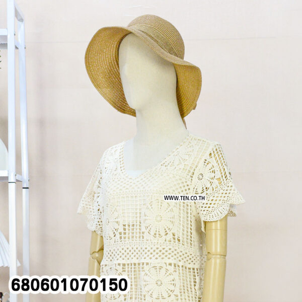 Front and back views of a handmade crochet summer blouse styled with straw hat and white shorts