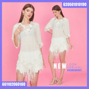 Crochet fringe blouse worn as a summer beach cover-up with lightweight boho style.