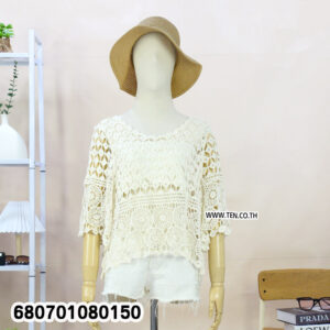 Boho-style crochet lace blouse in white and cream displayed on mannequin and hanger