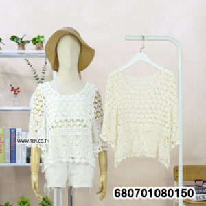 Boho-style crochet lace blouse in white and cream displayed on mannequin and hanger