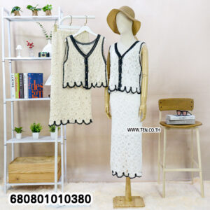 White crochet matching set with black trim, sleeveless top and midi skirt displayed on mannequin