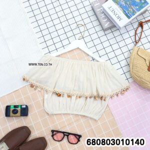 Bohemian summer off shoulder top with lace trim in beige and white, styled flat lay.