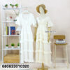 White tiered maxi dress with ruffle layers displayed on mannequin and hanger