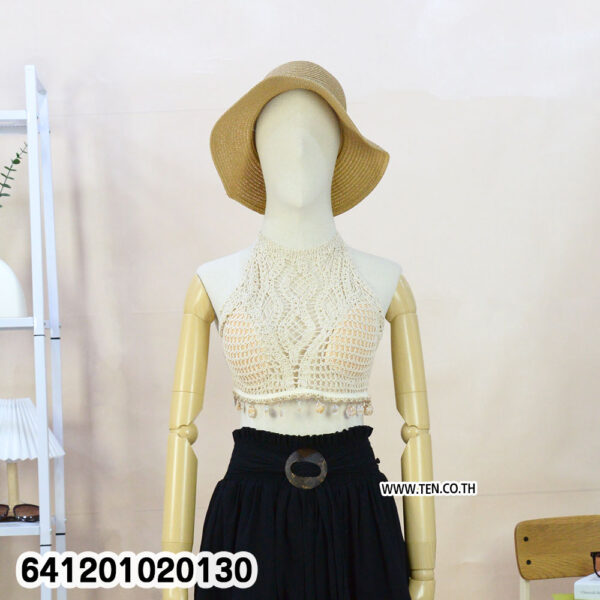 White crochet bralette for summer outfits with halter neck and tassel hem.