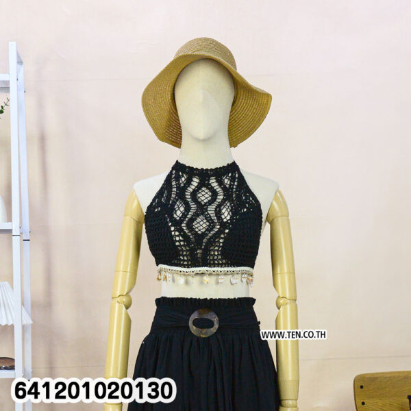 White crochet bralette for summer outfits with halter neck and tassel hem.