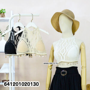White crochet bralette for summer outfits with halter neck and tassel hem.