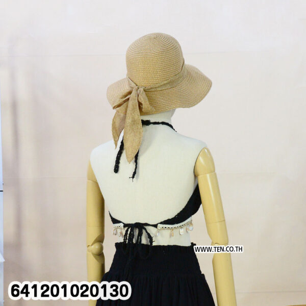 White crochet bralette for summer outfits with halter neck and tassel hem.