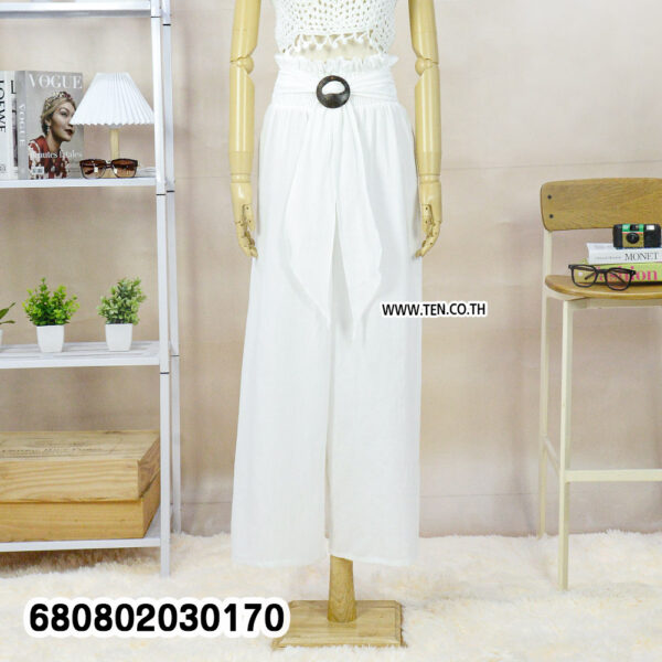 Summer palazzo pants styled with a straw hat and white crochet top on a mannequin