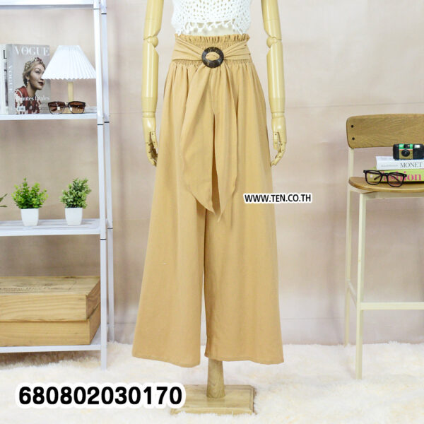 Summer palazzo pants styled with a straw hat and white crochet top on a mannequin