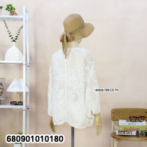 Lightweight lace jacket styled as a summer beach cover-up