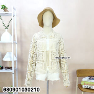 Sleeveless crochet cardigan styled for summer layering, displayed at Ten Design garment shop.