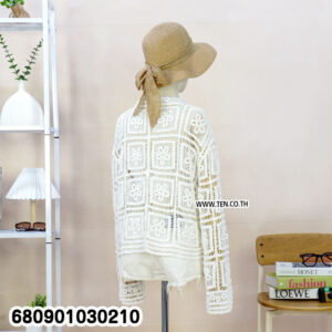 Sleeveless crochet cardigan styled for summer layering, displayed at Ten Design garment shop.