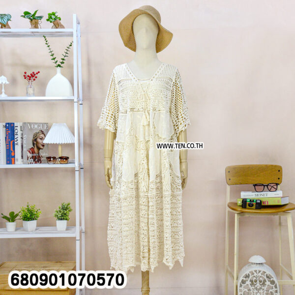 White and beige boho crochet summer dresses on mannequin and hanger