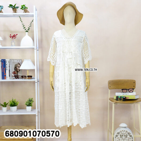White and beige boho crochet summer dresses on mannequin and hanger