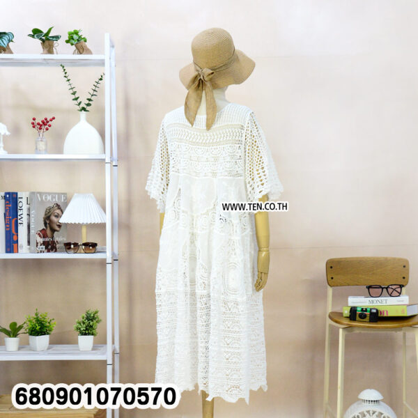 White and beige boho crochet summer dresses on mannequin and hanger