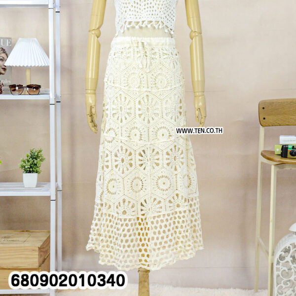 White crochet skirt with matching crop top, styled for summer outfit ideas.