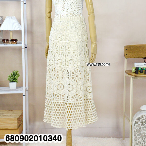 White crochet skirt with matching crop top, styled for summer outfit ideas.