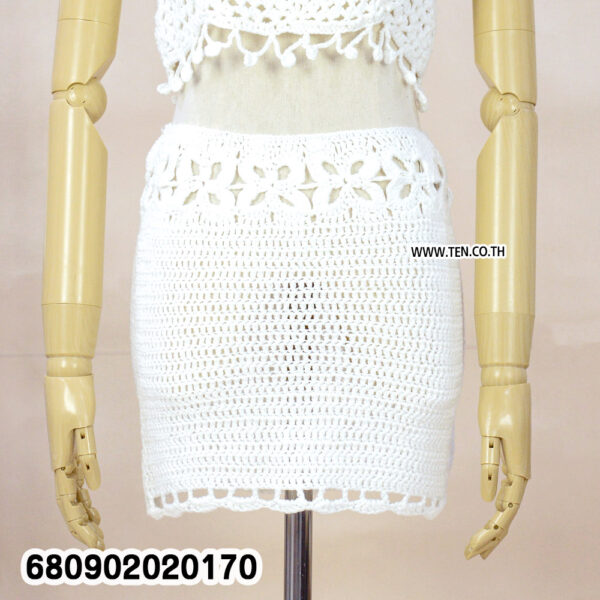 "Boho handmade crochet mini skirt styled with blazer and ankle boots for modern city chic look"