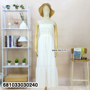 White long maxi dress styled with hat and ruffles for outdoor elegance