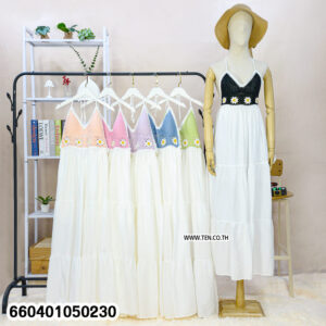 “Black crochet summer maxi dress with white skirt displayed on mannequin for beach fashion.”