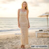 “Long crochet strap beach cover-up dress in black on mannequin by Ten Design, Thailand.”