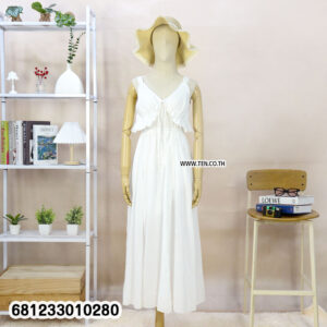 Sleeveless flowy white cotton maxi dress with ruffle neckline and lightweight fabric for summer and beachwear