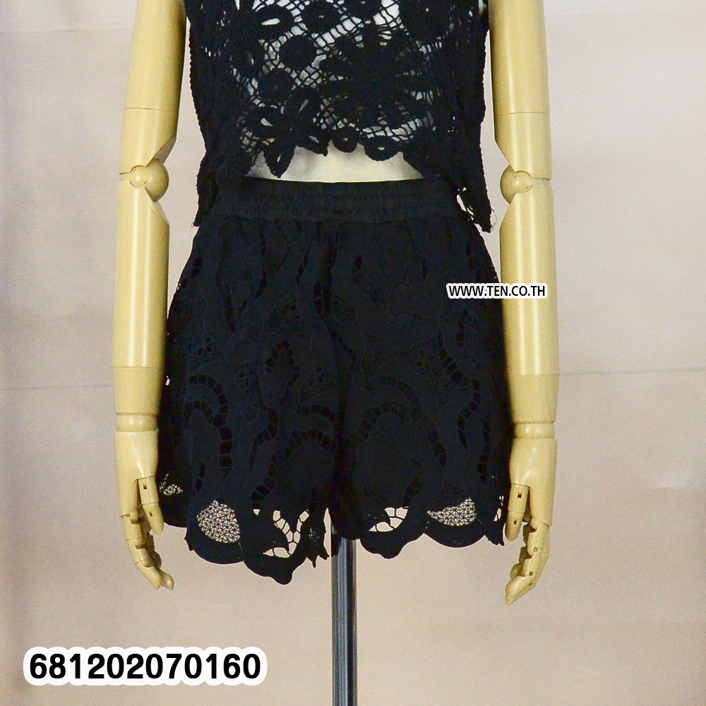 Vintage floral embroidery lace shorts in black and white with elastic waistband styled for summer beachwear and resort outfits
