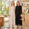 Minimalist monochrome crochet long dress in black and white with lace hem detail for summer resort wear